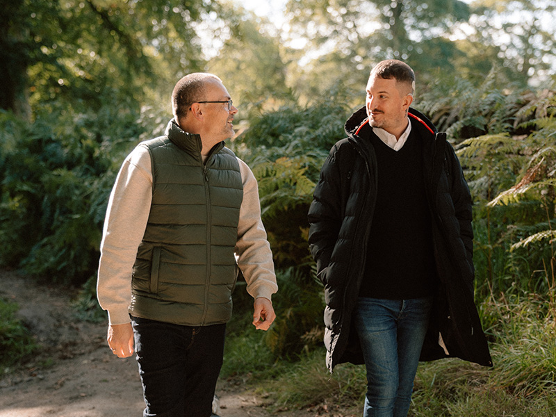 Ben and his husband David walking outside.