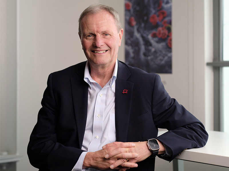 Professor Bryan Williams standing in an office.