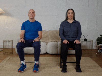 Hara and Robert performing a neck stretch exercise.