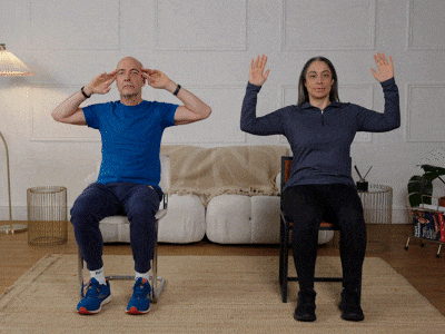 Hara and Robert performing a chest opener exercise.