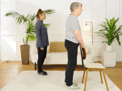 Hara and Elizabeth performing hamstring curls.