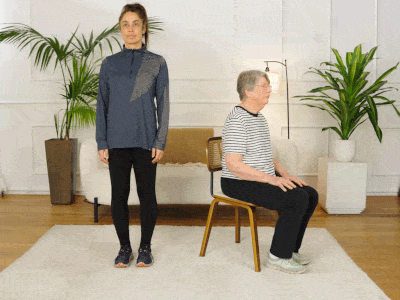 Hara and Elizabeth performing a hamstring stretch.