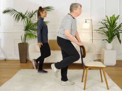 Hara and Elizabeth performing a quadriceps stretch.