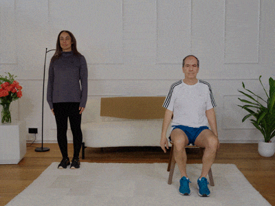 Hara and Stefano performing side steps with arm raises.