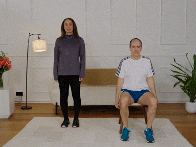 Hara and Stefano performing foot pedals with double bicep curls.
