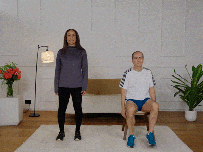 Hara and Stefano performing a side bend stretch.