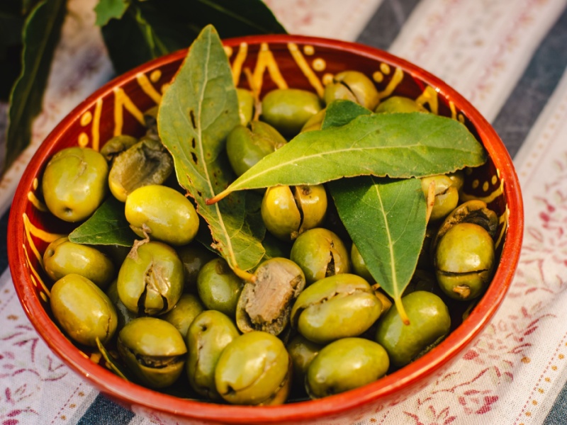 A bowl of green olives.