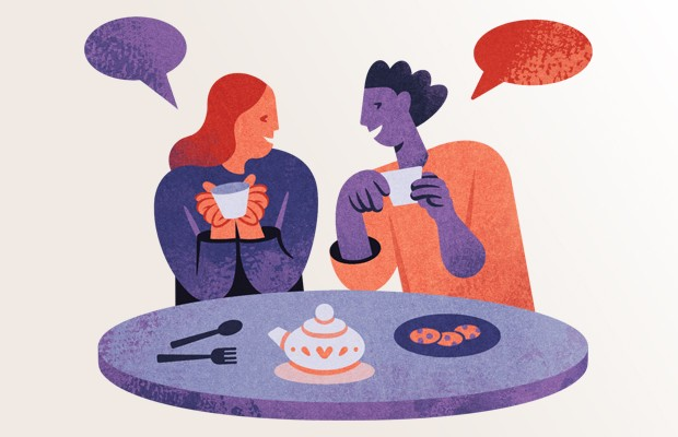 Stylised illustration of two people sitting next to each other at a table, holding cups of tea and talking, with speech bubbles above them and a tea pot on the table.