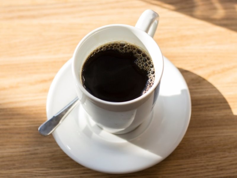 A cup of black coffee.