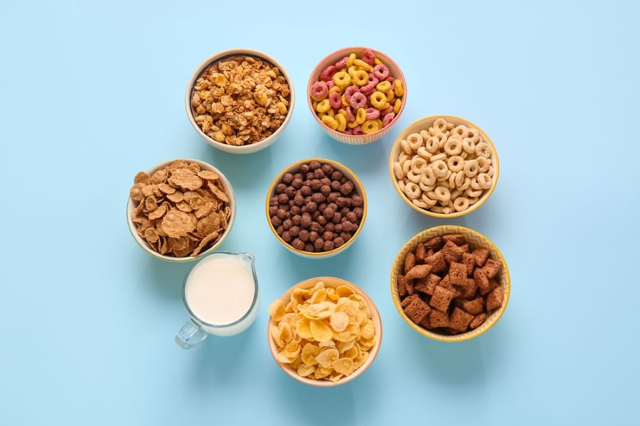 Different types of cereal in bowls.