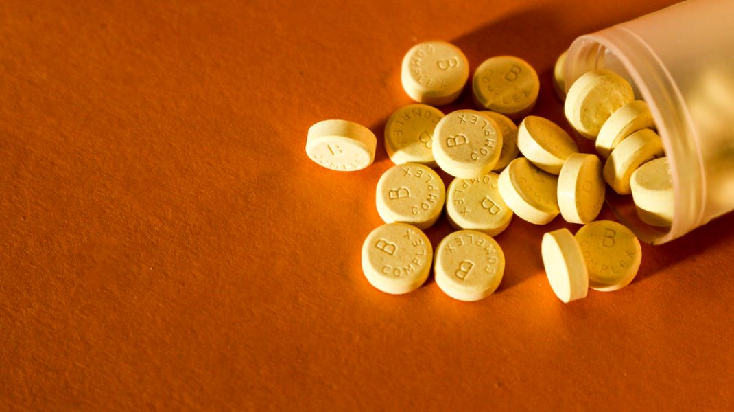 Pill jar containing vitamin B tablets