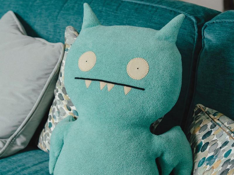 A blue soft toy of a bat.
