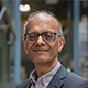 Headshot of Professor Ajay Shah in an office.