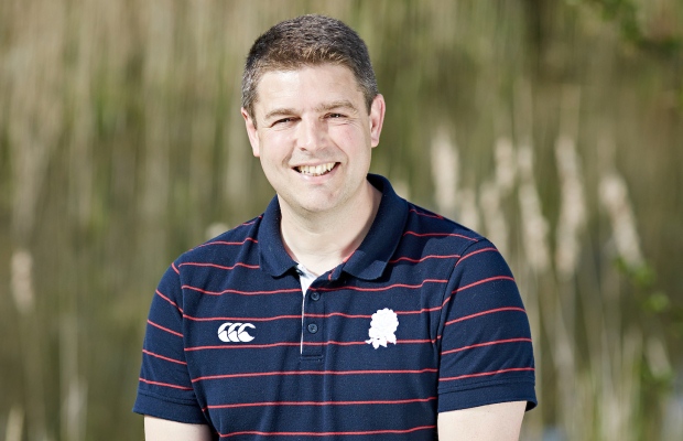 Jonathan Kirkman smiling in a polo shirt