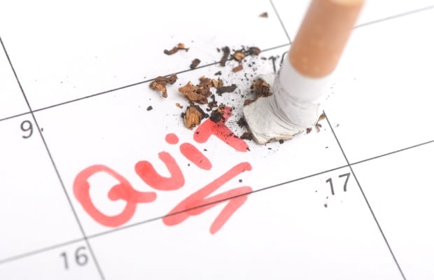 Cigarette put out on a specific date on a calendar