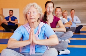 A group of people doing yoga