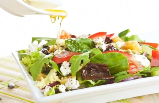 A healthy salad with an oily dressing