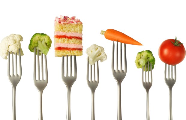Portions of vegetables and a piece of cake
