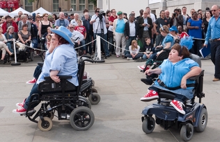 Four wheelchair users perform a wheelchair dance in Trafalgar Square, London.