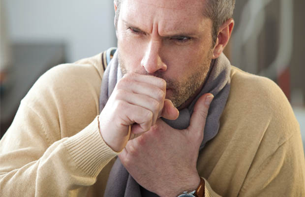 A man coughing