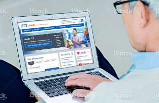 Man looking at computer - NHS care