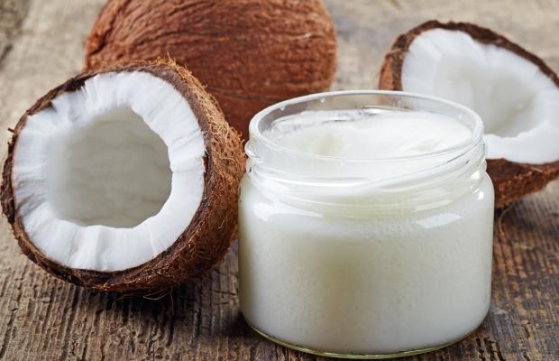 Jar of coconut oil and coconuts