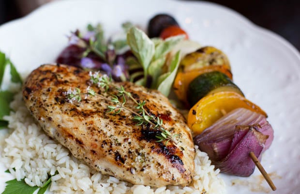 Chicken marinated with fresh herbs and served with a vegetable kebab