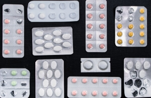 A range of tablets and pills in their packaging