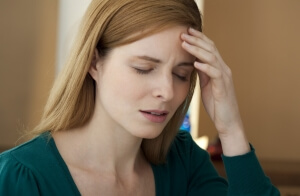 A woman with a migraine with aura, associated with stroke