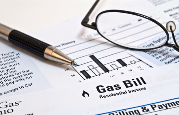 Pen and glasses on a gas bill