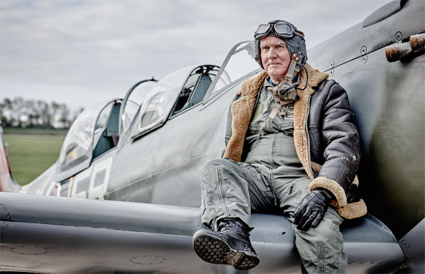 Andrew McDonald sitting on spitfire wing