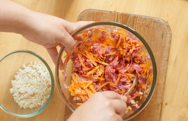 Mixing minced beef, onion and carrot