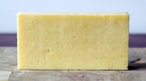 A block of reduced-fat cheddar cheese