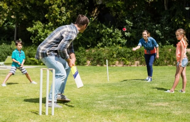 A family playing cricket