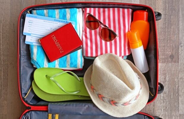 Open suitcase prepared for a holiday