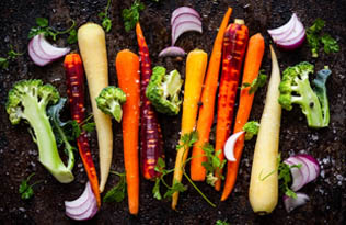 Colourful vegetables on a black background