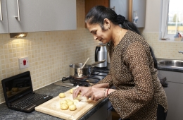 A woman chopping potatoes 