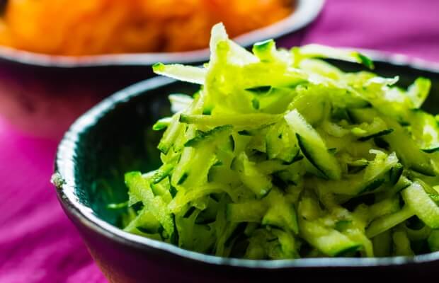 A bowl of grated courgette