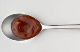 Ketchup tomato sauce on a spoon