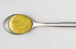 Mustard sauce on a spoon