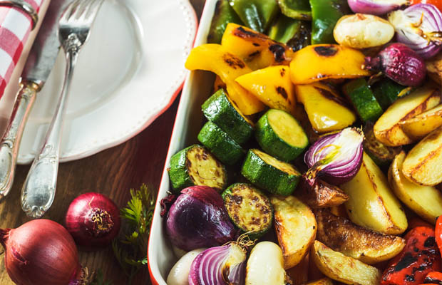 Roast mixed vegetables in a baking dish