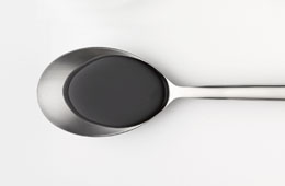 Soy sauce on a spoon