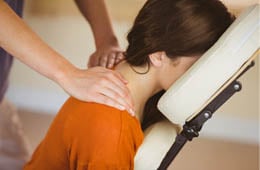 A woman getting a massage as a treat