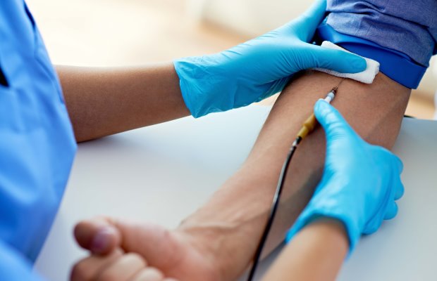 A haemochromatosis patient having a venesection