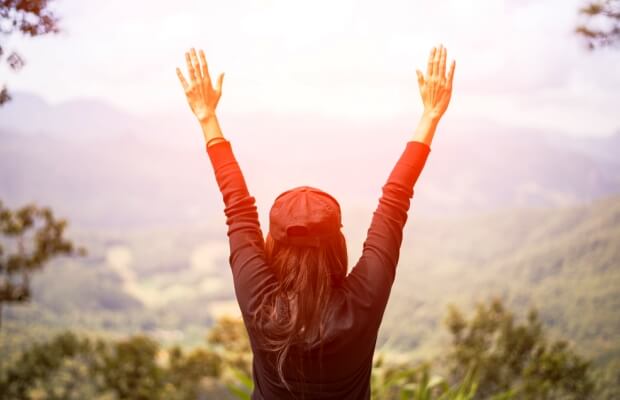Woman exercising feeling happy and strong