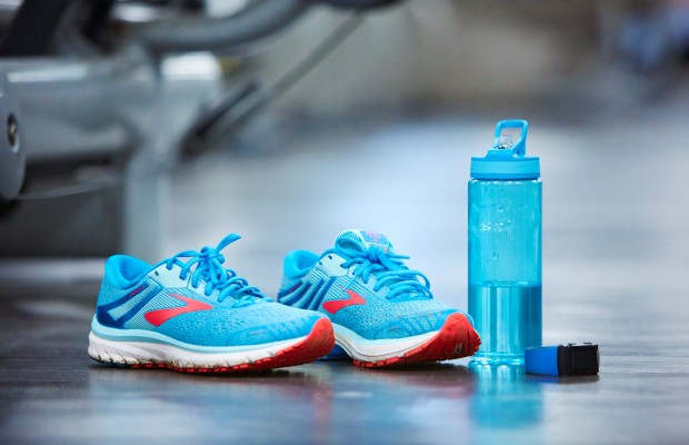 Running trainers and a bottle of water