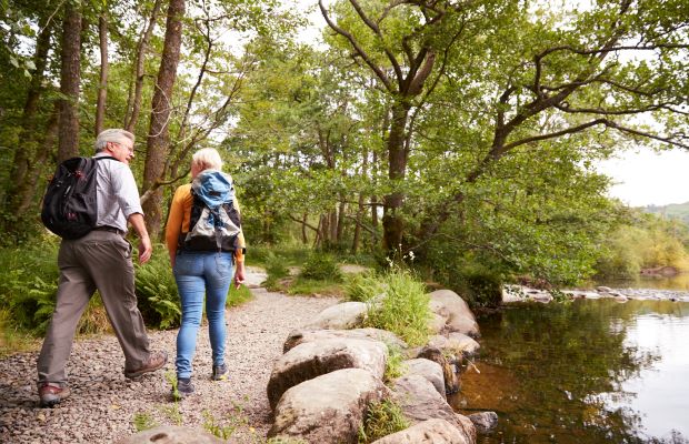 couple walking in woods