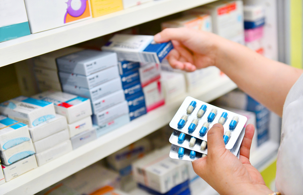 A selection of medicine on a pharmacy shelf
