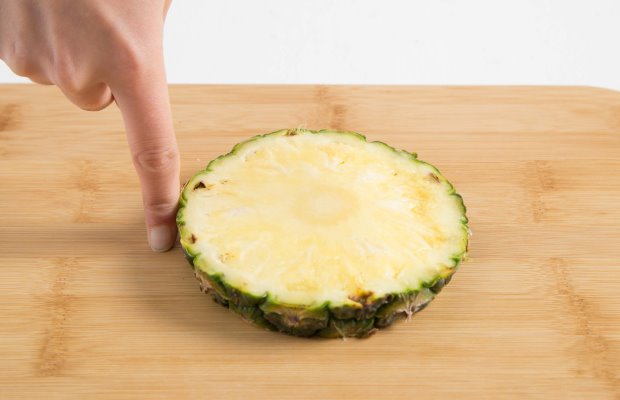 A one portion slice of pineapple