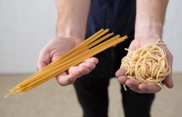 Portions of uncooked and cooked spaghetti